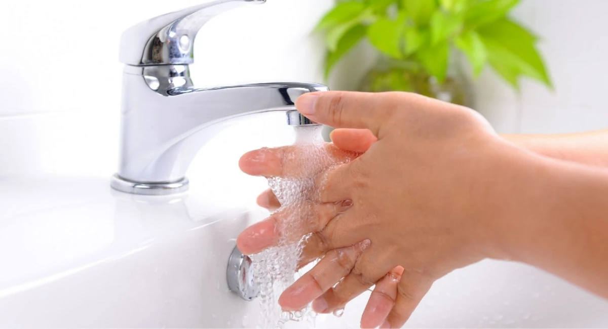 child washing their hands
